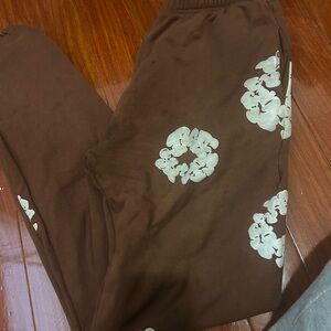 Denim Tears Brown Pants with White Floral Design